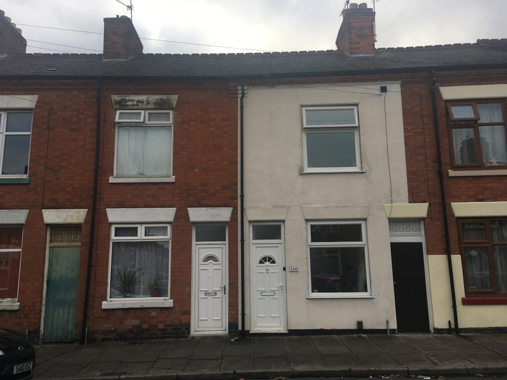 Mould growth above a window caused by blocked guttering