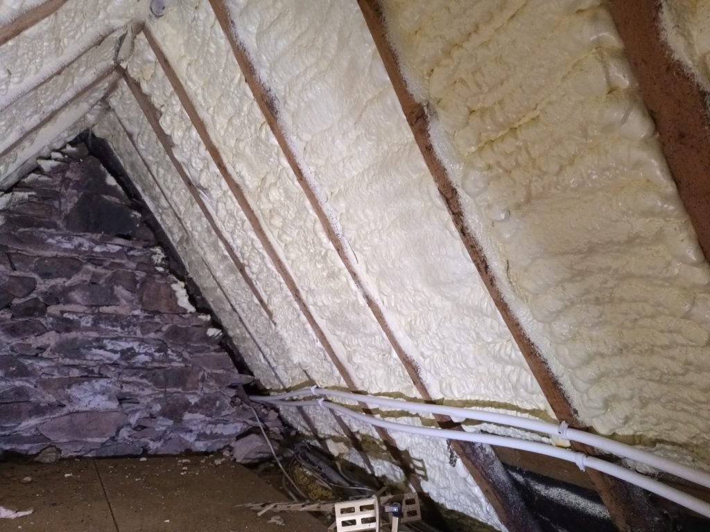 Roof timbers after spray foam insulation has been removed